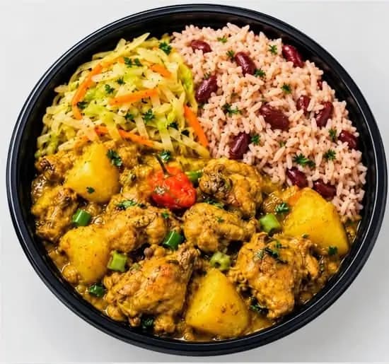 Chicken curry with rice and beans, cabbage, and carrots