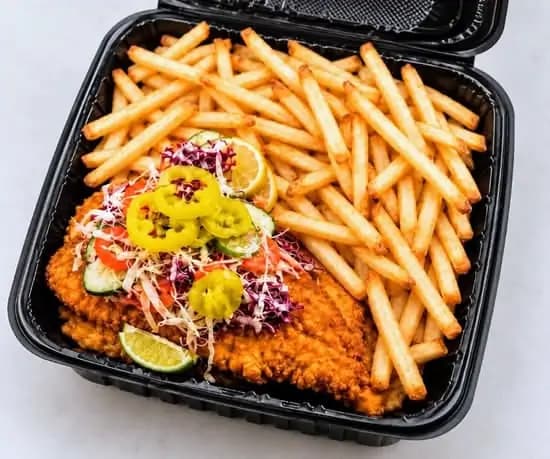 Fried whiting fish with fries and shredded vegetables